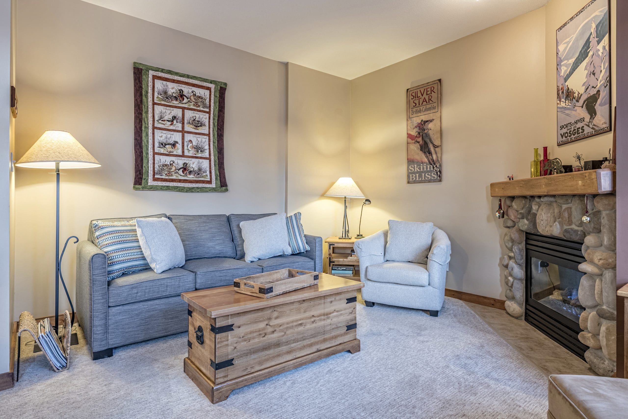 Bright living room with gas fireplace in this 2 level corner townhouse at Creekside. Ski in and out right to your door, free parking at your front door, private hot tub and private laundry.