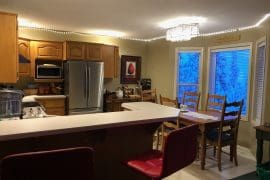 Cozy penthouse suite on the Knoll. Pet-friendly, private hot tub, laundry, large entryway for gear. Walk upstairs to large fully equipped kitchen, and open concept dining/living area.