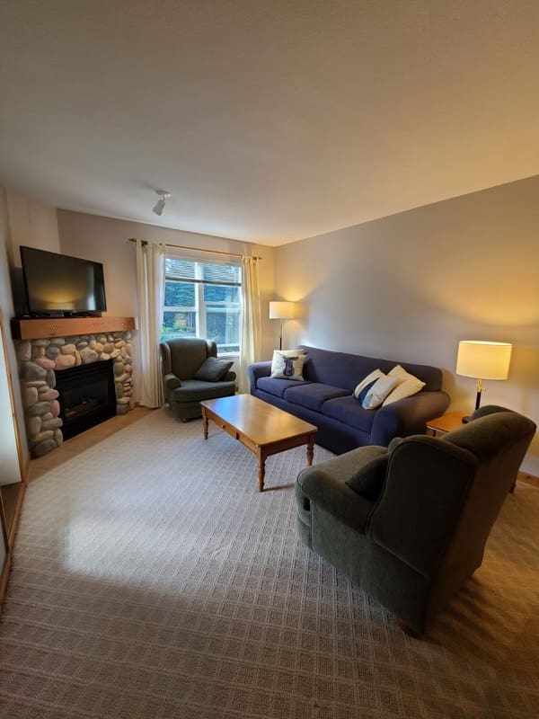 Cozy corner condo on second floor but ground level access and balcony with private BBQ. Gas fireplace, TV, and enough space for family or small group or friends.
