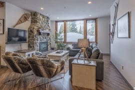 Modern deluxe private suite with open concept living, huge dining area, bright windows. Enjoy the private hot tub and ski right from the door!