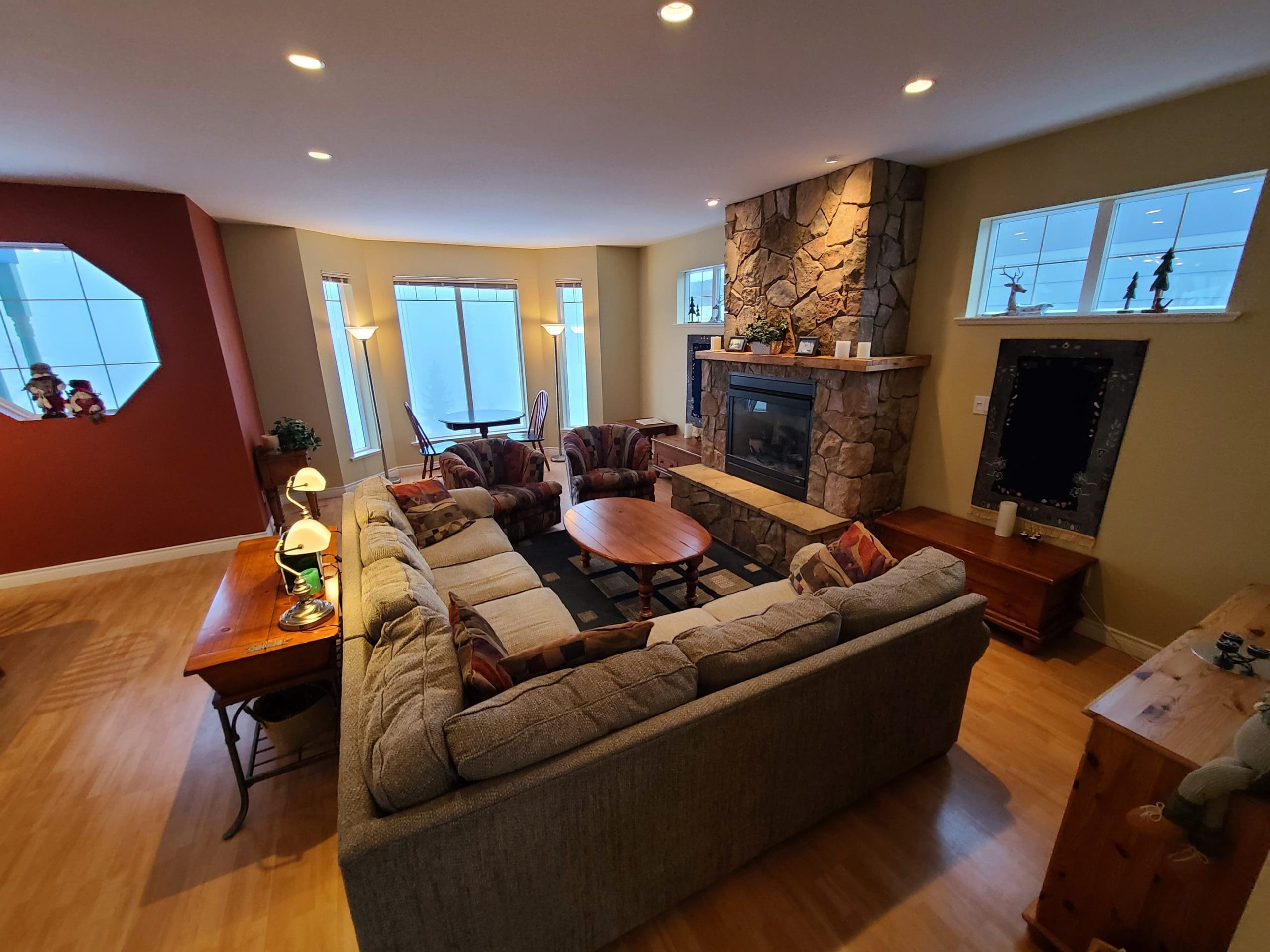 Living Room with gas fireplace, TV and great views of the village. Private Hot Tub and pet-friendly too!