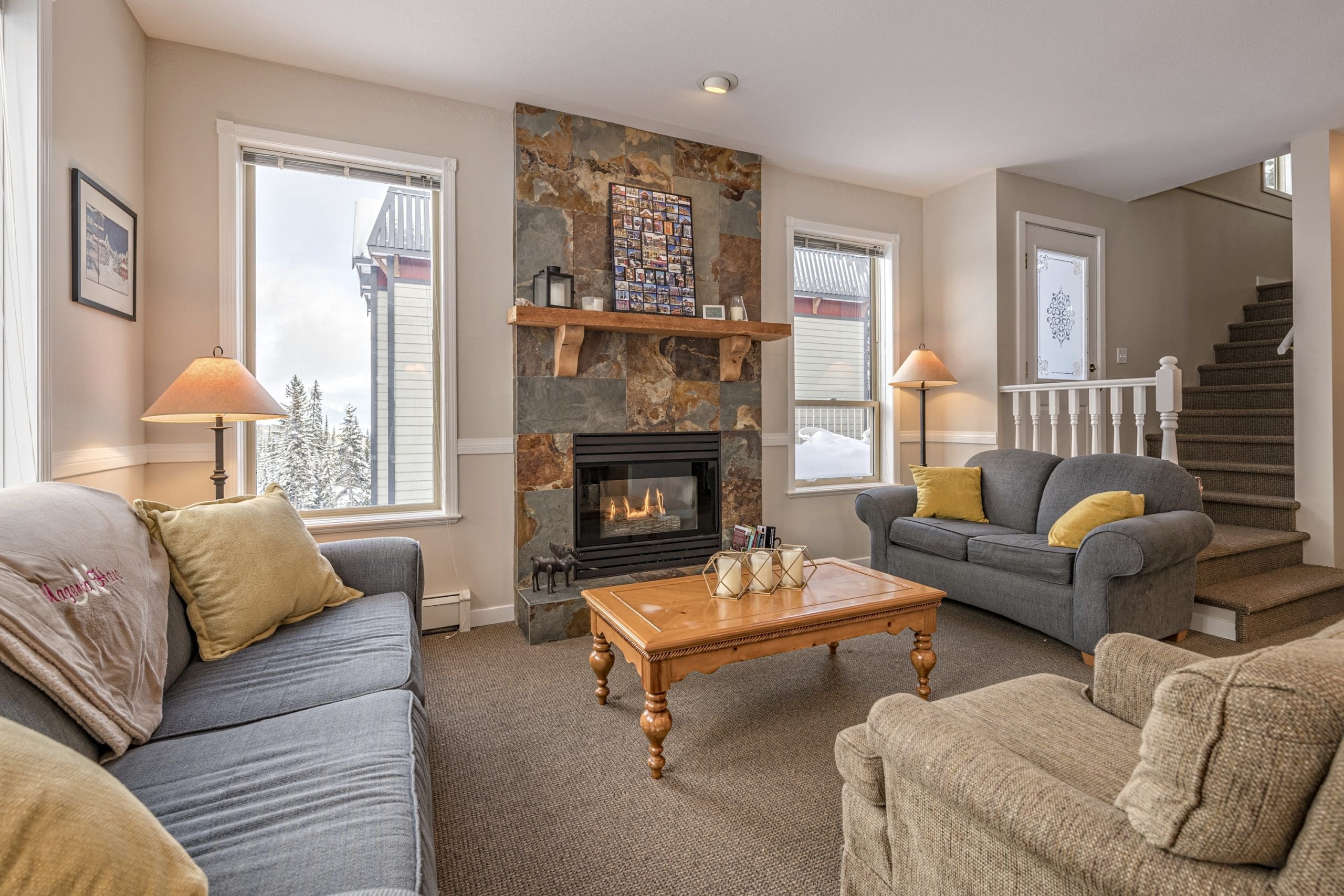 This Upper level living room is newly renovated, bright open windows, gas fireplace, large outdoor deck with brand new BBQ. Featuring a private hot tub, laundry, and enough space for everyone to spread out.