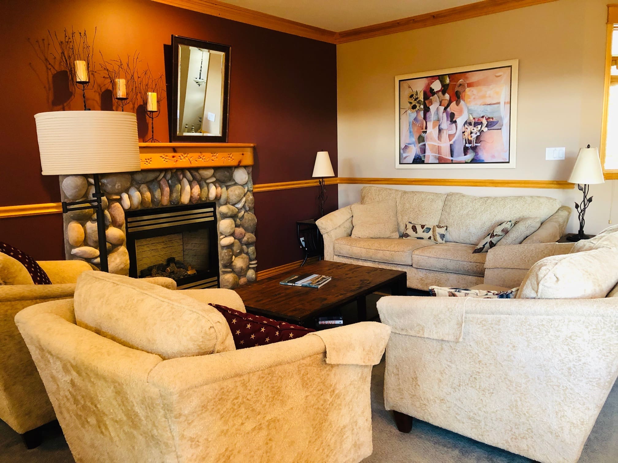 Living room of townhouse with gas fireplace, dining area, fully stocked kitchen and pantry. Also has an outdoor deck with BBQ and private hot tub. Private laundry and garage for storage/parking.