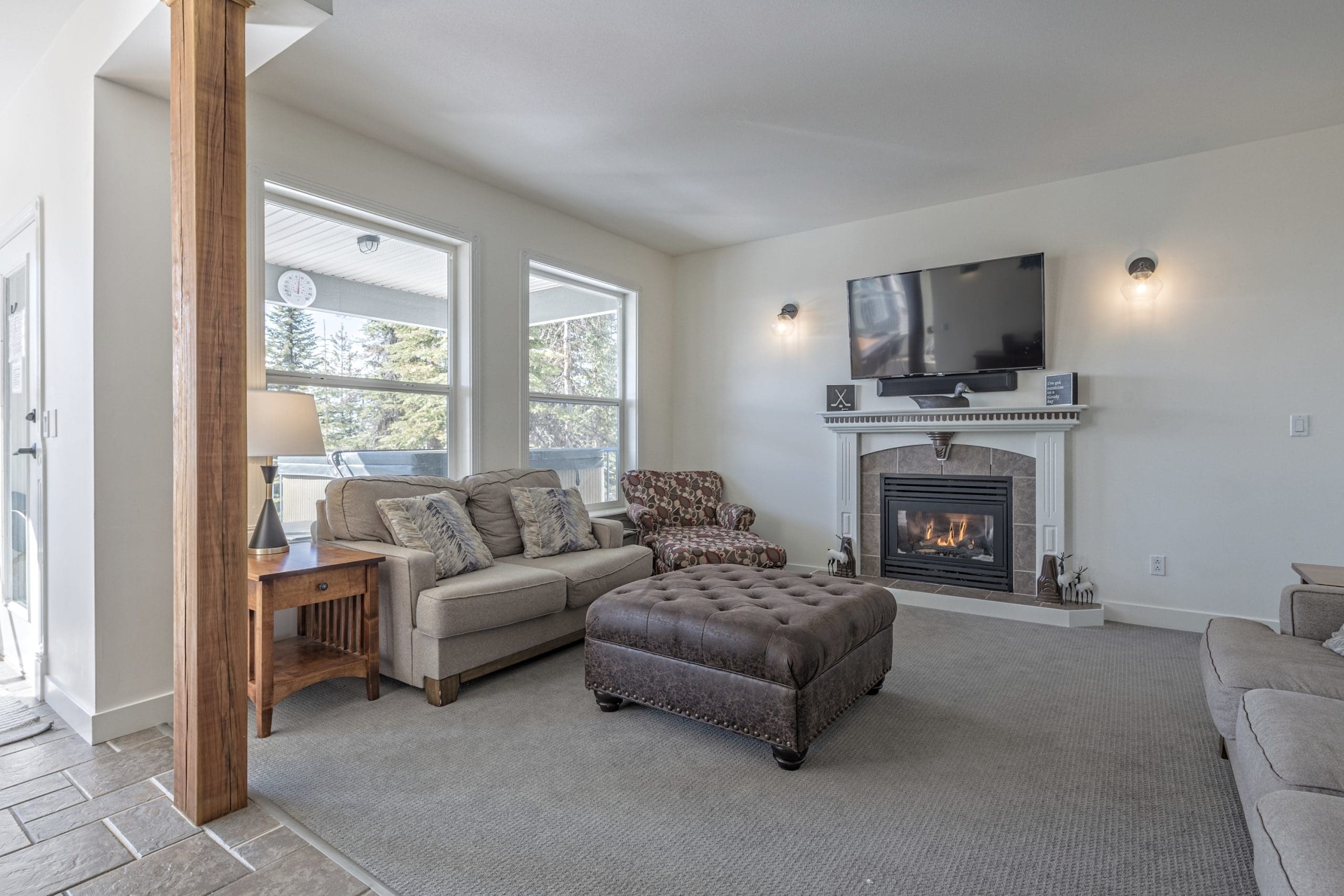 Eldorado Upper living room with incredible mountain views, BBQ on deck, private hot tub, shared laundry and ski room with waxing bench. Amazing ski in and out access right from the house!