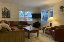 Bright ground level suite living room with views of the Alpine Meadows chairlift. Private hot tub, laundry, and exceptional ski in and out right from the back of the home to the lifts. Less than a 5 minute walk to the village too.