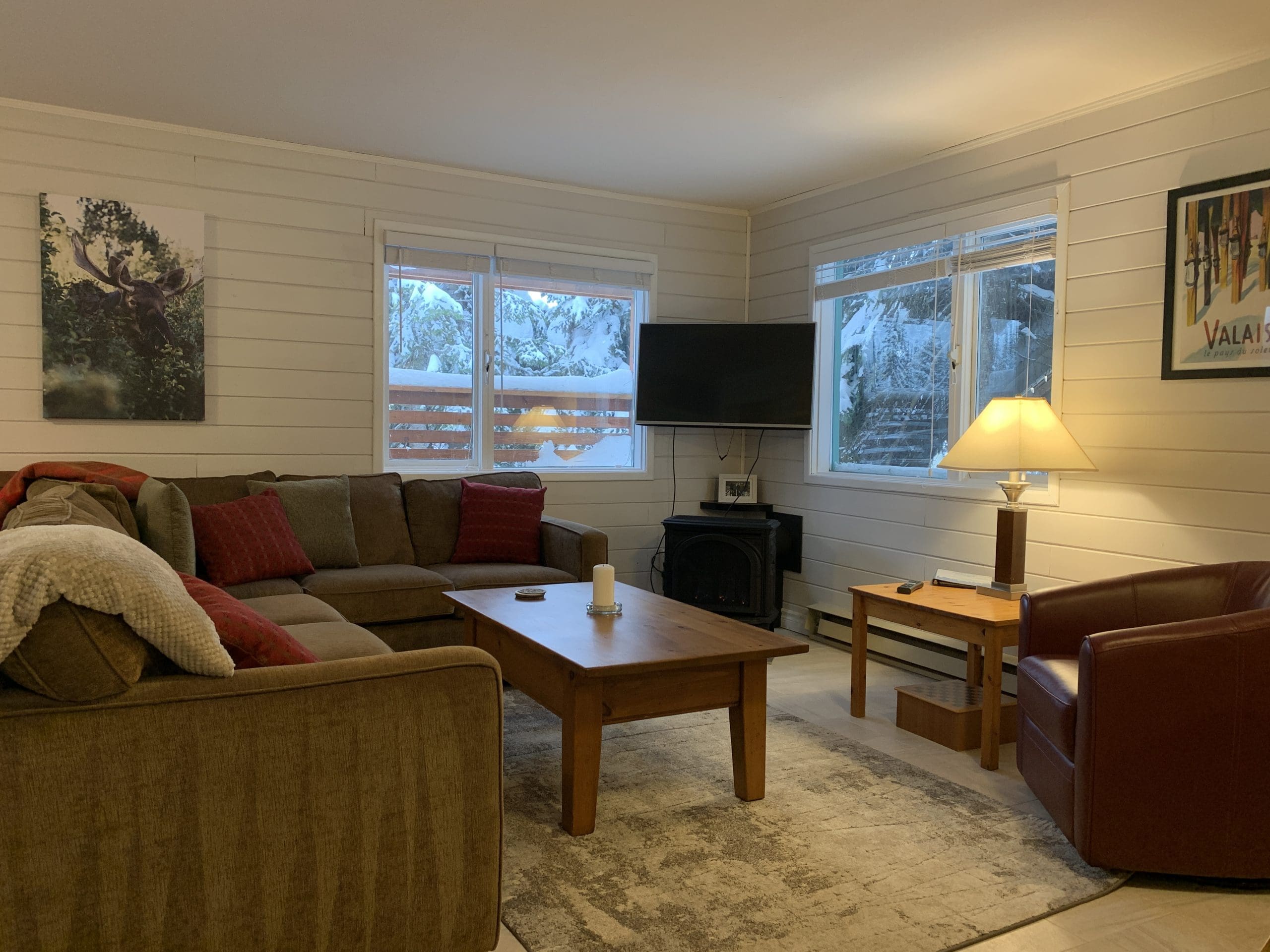 Bright ground level suite living room with views of the Alpine Meadows chairlift. Private hot tub, laundry, and exceptional ski in and out right from the back of the home to the lifts. Less than a 5 minute walk to the village too.
