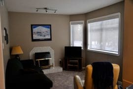 Living Room with gas fireplace & TV