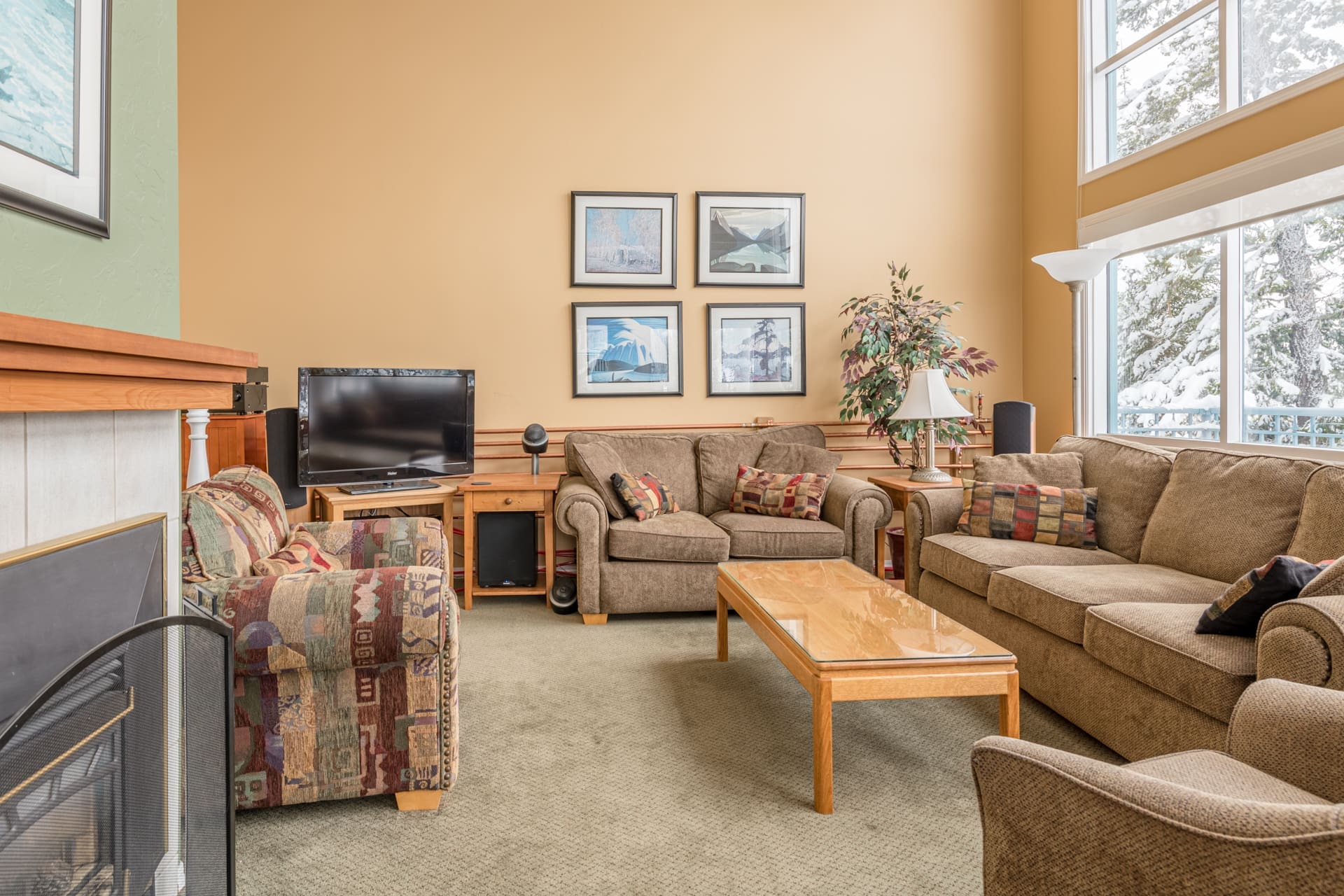 Upper Living Room with bright open windows and incredible views. Gas fireplace, private hot tub, laundry, garage for storage, and the skiway is right outside the back of the home to whisk you to the village in moments. Pet-friendly too!
