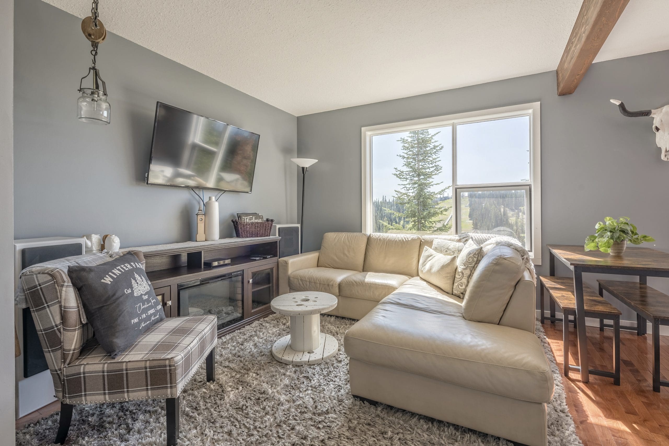 Bright open concept living space with incredible views. Large couches and well equipped kitchen.