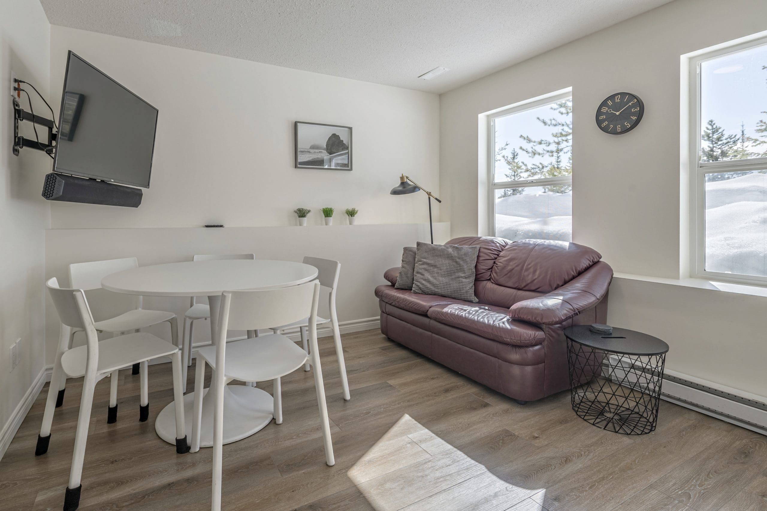 1 bedroom + private den suite with gas fireplace, TV, dining table and full kitchen. Features a private hot tub, shared laundry, ski room with waxing bench and amazing ski-in and out access.