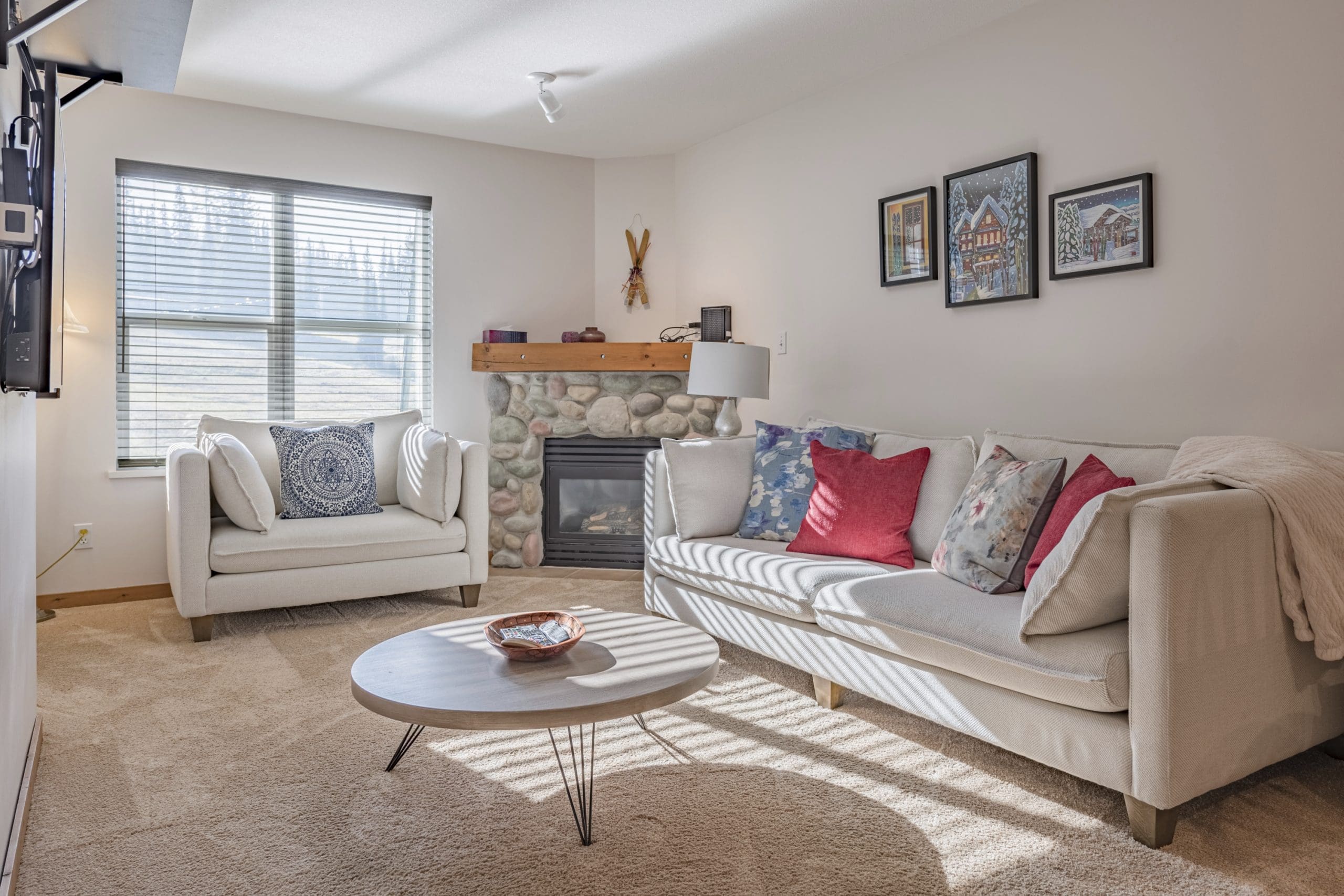 Living Room of Newly Renovated 2 bed/1 bath ground floor condo at Creekside. Ground level access with balcony overlooking chairlifts. Gas fireplace, TV, free parking and fully stocked kitchen.