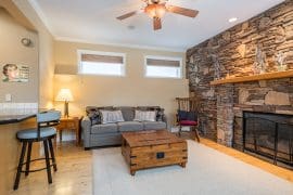 Living Room with large gas fireplace, beautiful decor, bright open concept living. Fully stocked kitchen with modern appliances. Pet-friendly home with private hot tub, laundry, sauna, garage for parking or storage, natural gas BBQ and incredible ski in and out access to the top of the Silver Queen Chair.