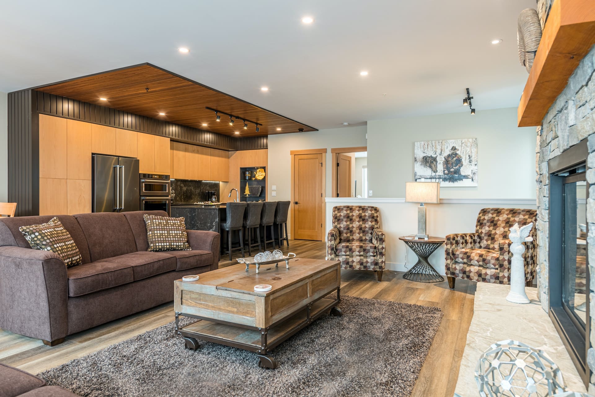 Penthouse Living Room and Kitchen. High ceilings, modern finishings, upgraded high-end kitchen. Bright windows, lots of space.