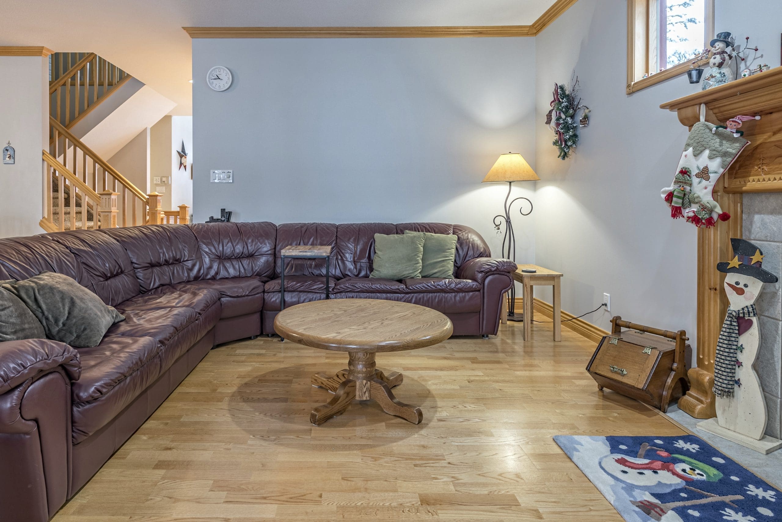 Living room of Snowhaven. Large open concept living area, large dining table and fully equipped kitchen. Private hot tub overlooking the trees, laundry, ping-pong table, and fantastic ski in and out from the home.